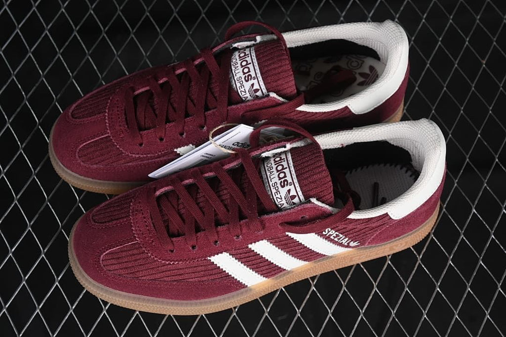 Pair of burgundy Handball Spezial sneakers shown from above