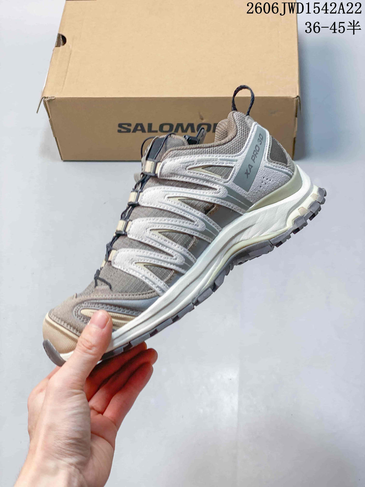 Side view of a taupe and gray Salomon XA Pro 3D sneaker.