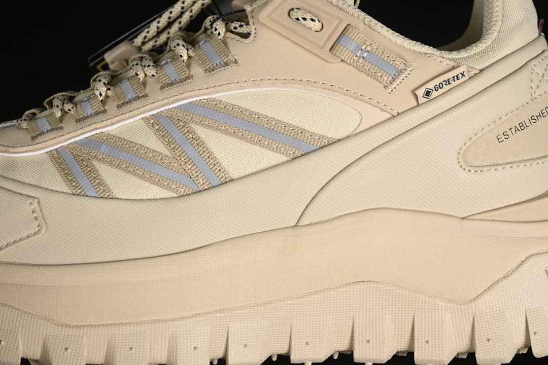 Side detail of the sneaker showing striped panels and a GTX label.