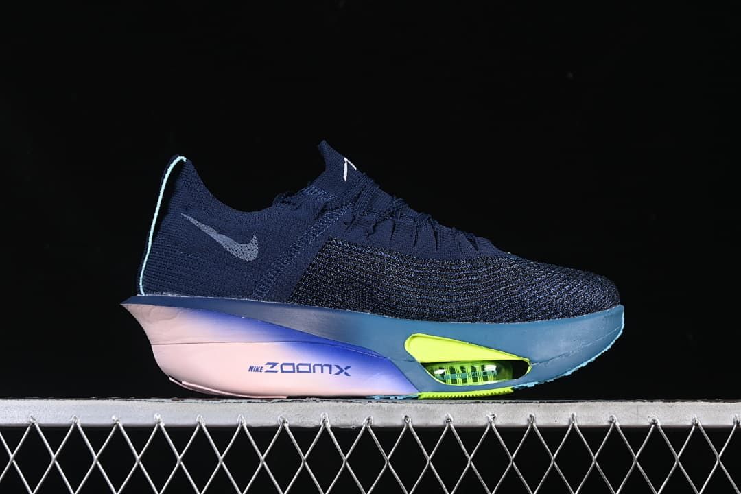 Side profile of a navy shoe with a pale swoosh and lime cushioning accent.