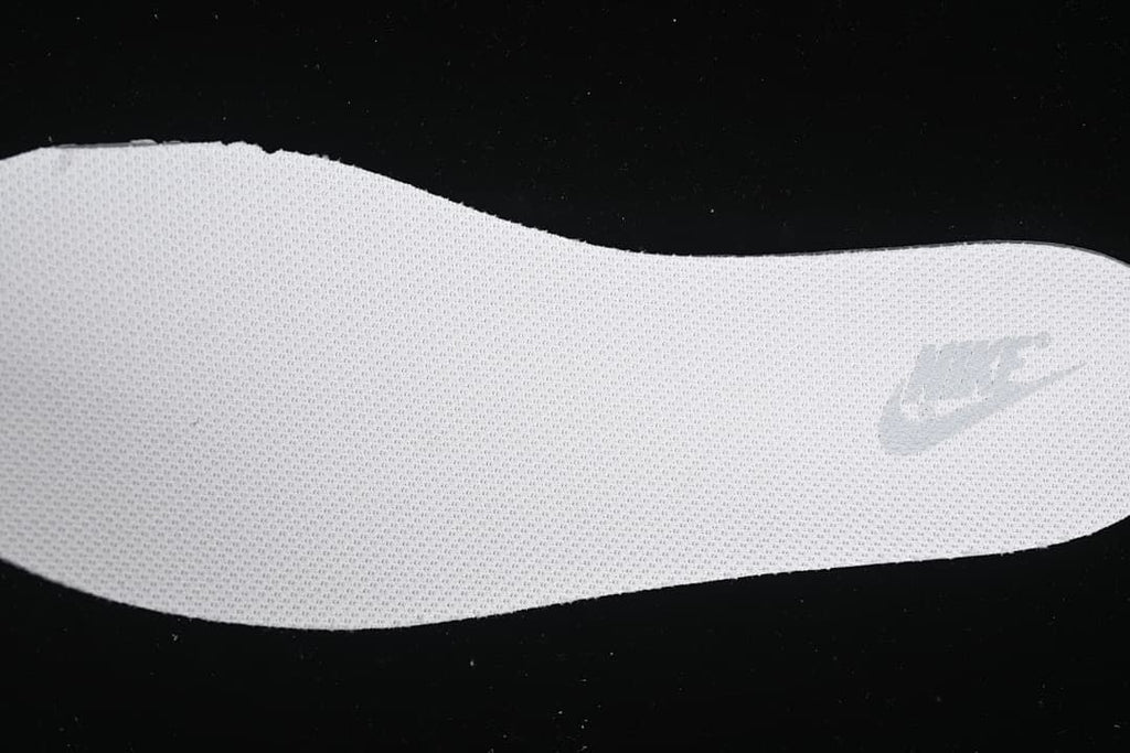 Close-up of the textured insole and Nike mark.