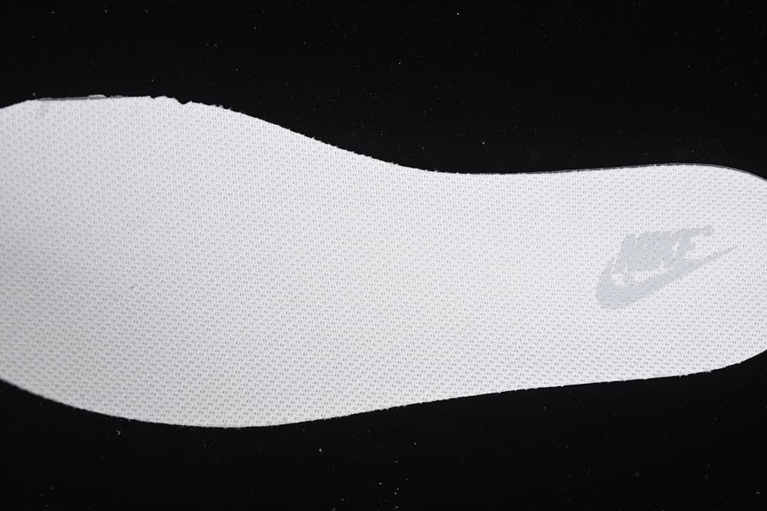 Close-up of the textured insole and Nike mark.