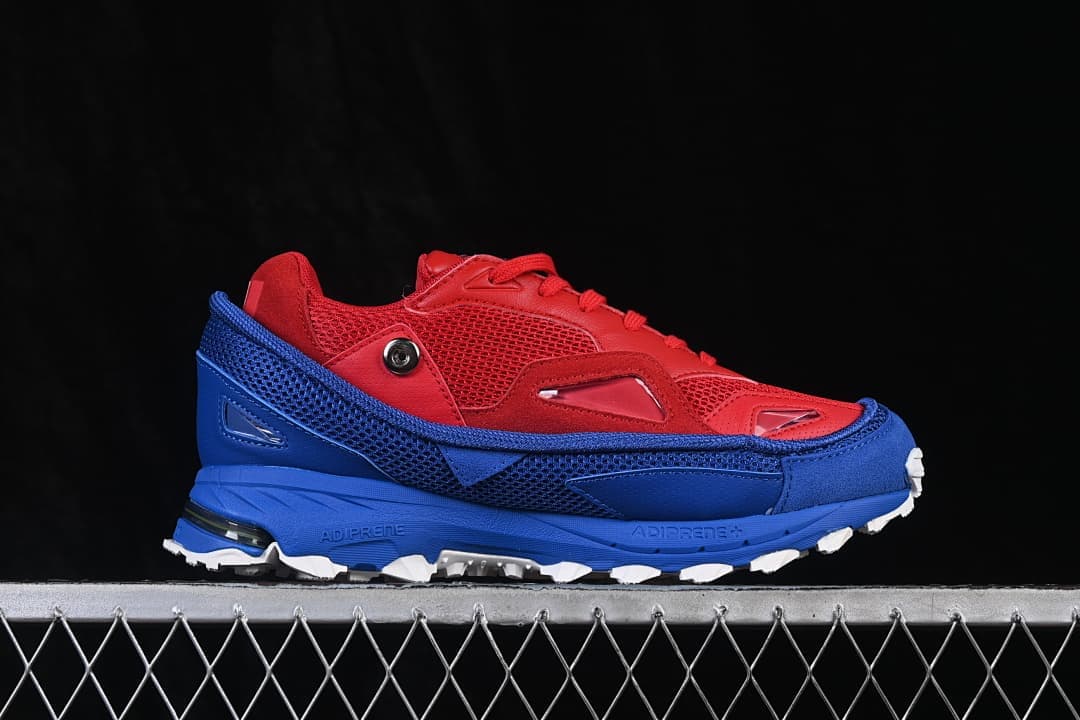 Side profile showing red mesh upper and blue midsole