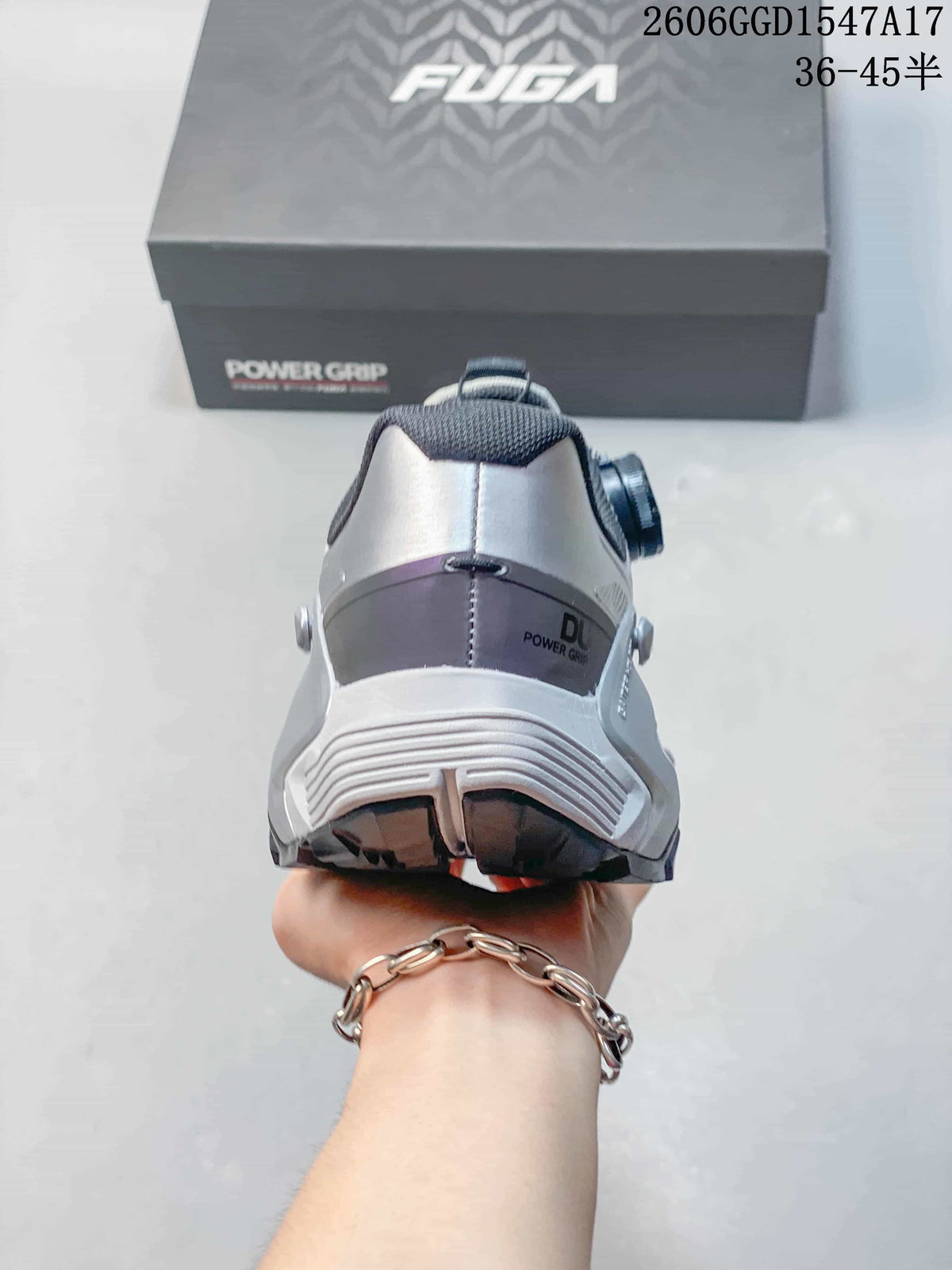 Rear view of the silver-gray shoe showing its heel structure and outsole.