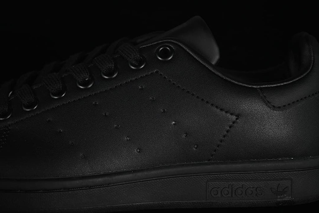 Close-up of the perforated side panel, laces, and midsole branding