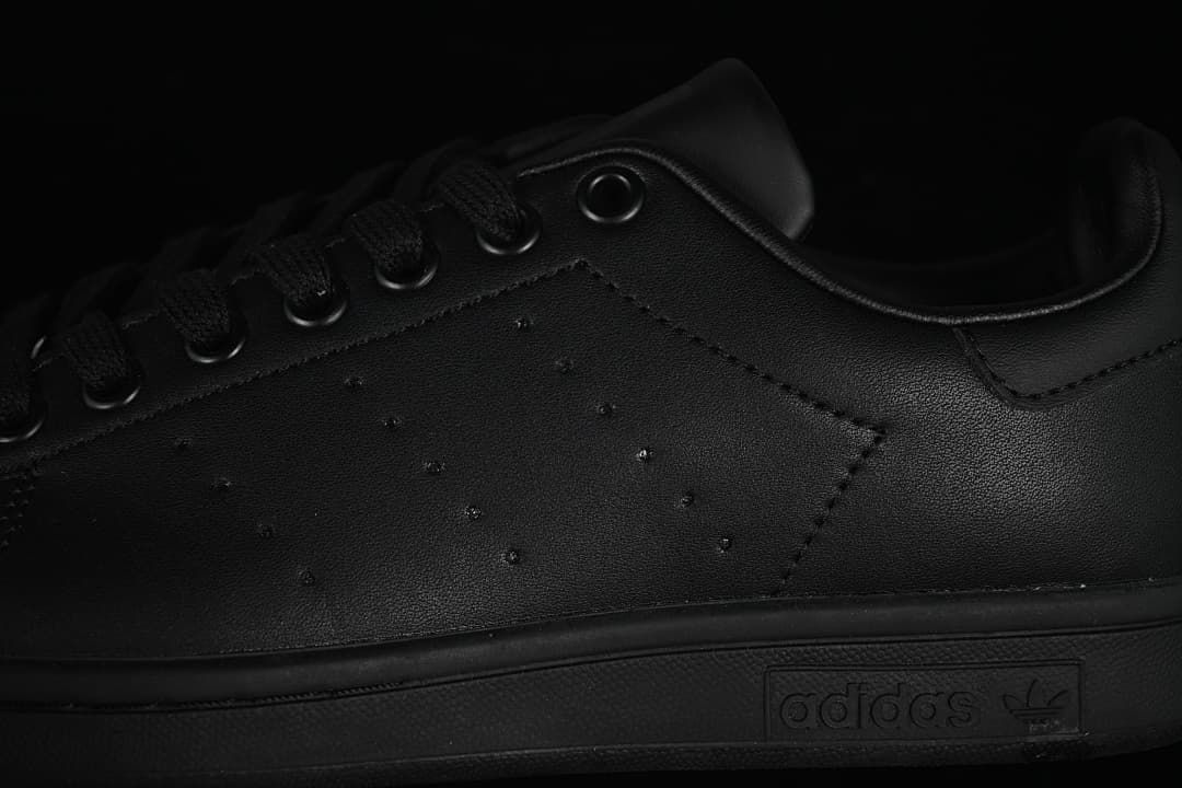 Close-up of the perforated side panel, laces, and midsole branding
