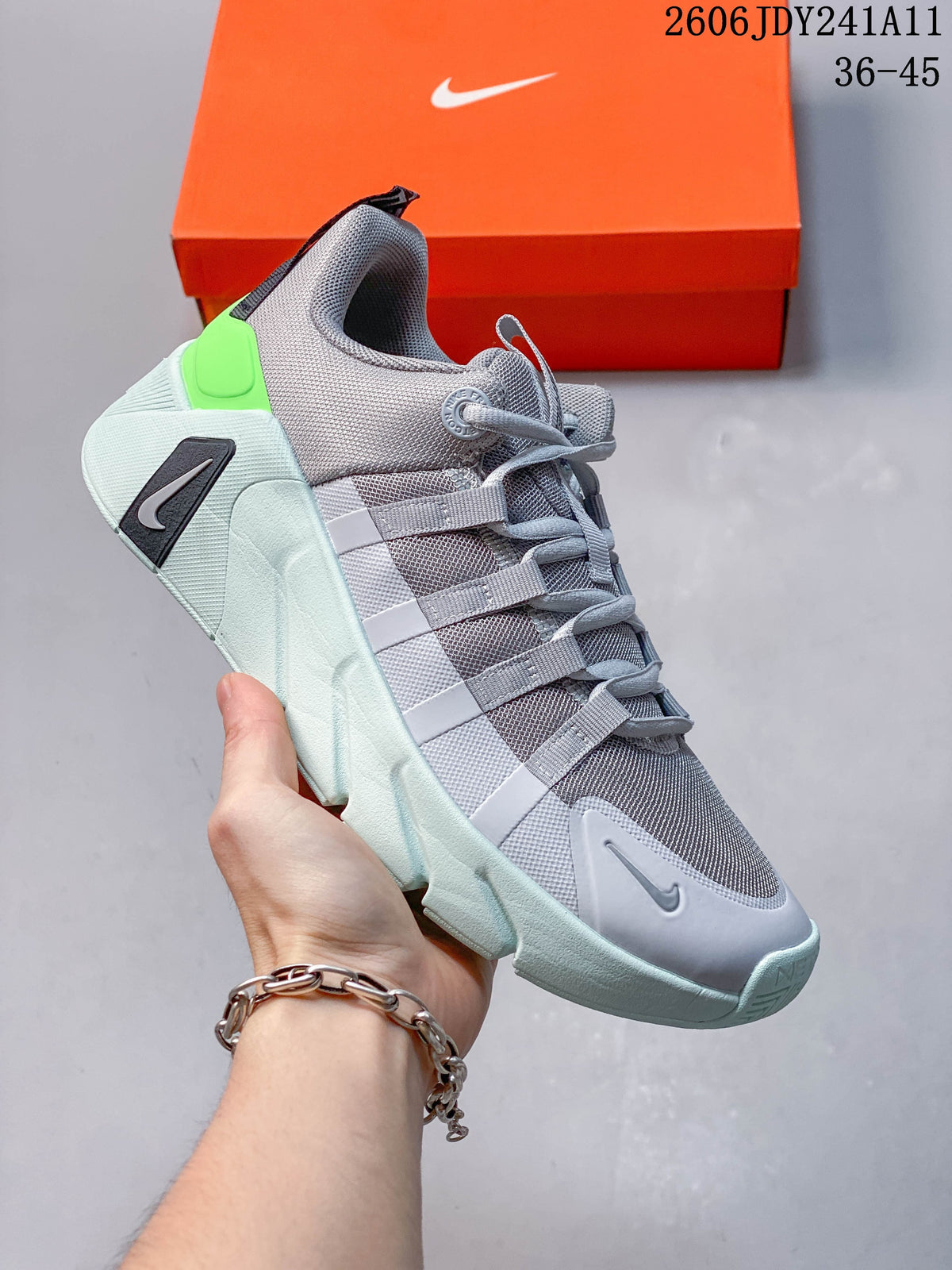 Gray Nike Free Metcon 7 training shoe with pale mint sole and bright green heel detail.