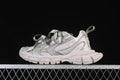Side view of taupe Balenciaga 3XL sneakers with oversized ribbon laces