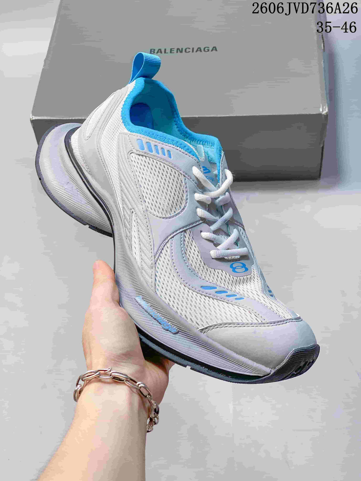 White sneaker with blue accents, mesh-look panels and a thick sculpted sole