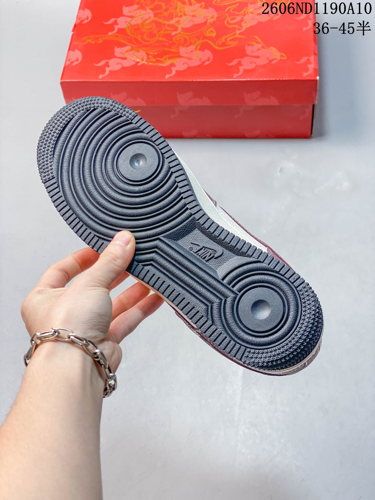 Close-up of the sneaker's dark outsole with circular tread details