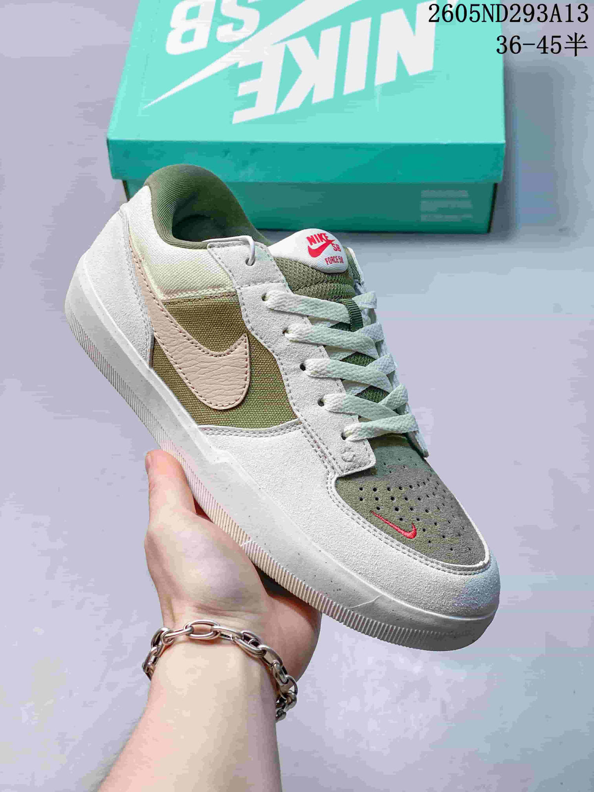 Angled side view of the Nike SB Force 58 shoe in olive, white, and pale pink.