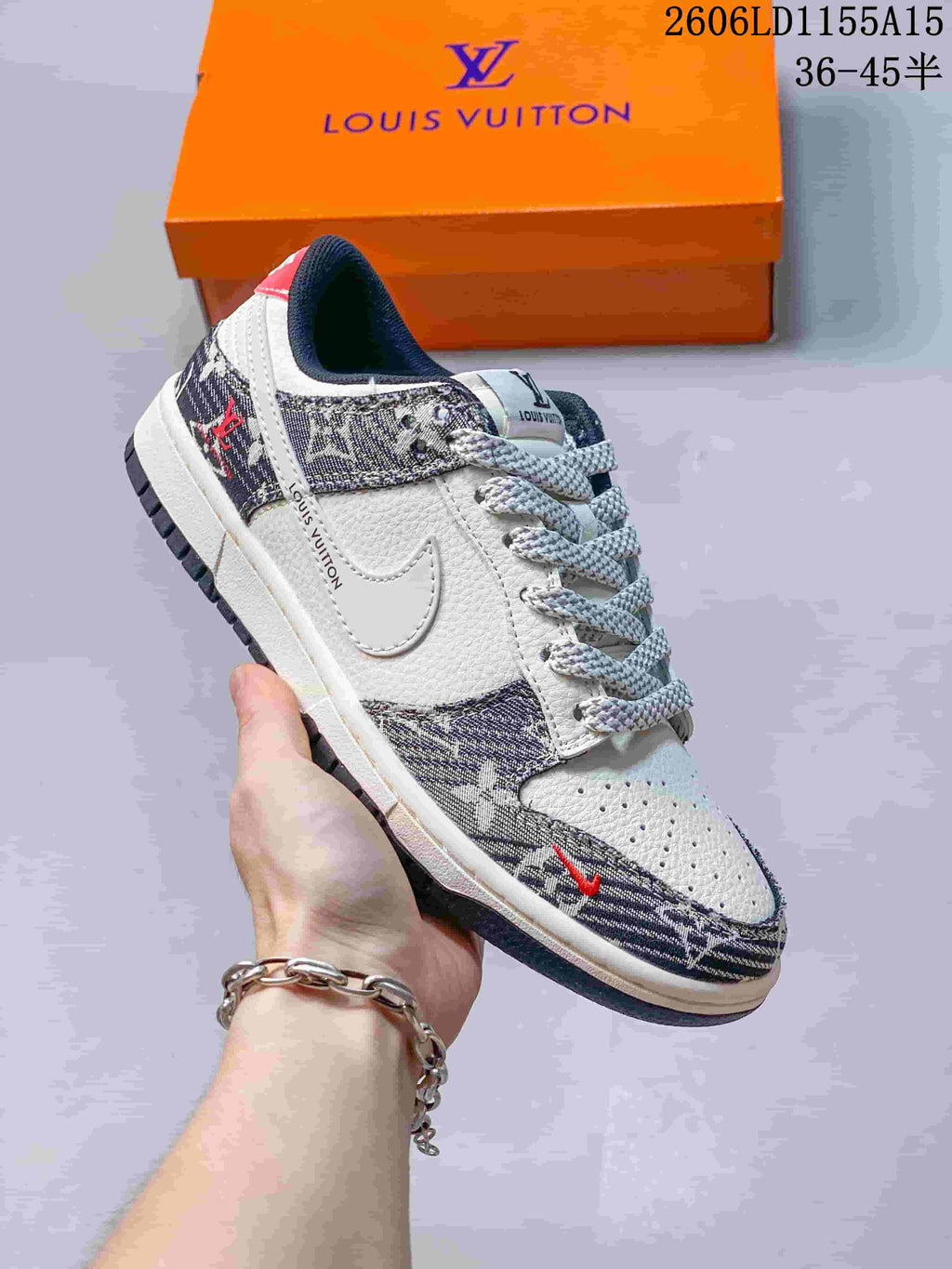 Angled side view of a white low-top sneaker with patterned panels and red accents