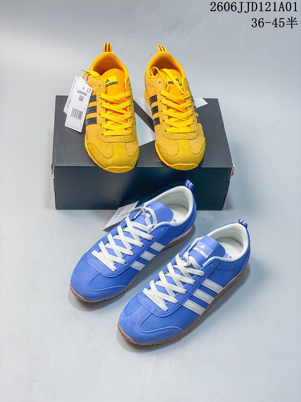 Yellow and blue adidas VS JOG 2.0 sneakers shown together.