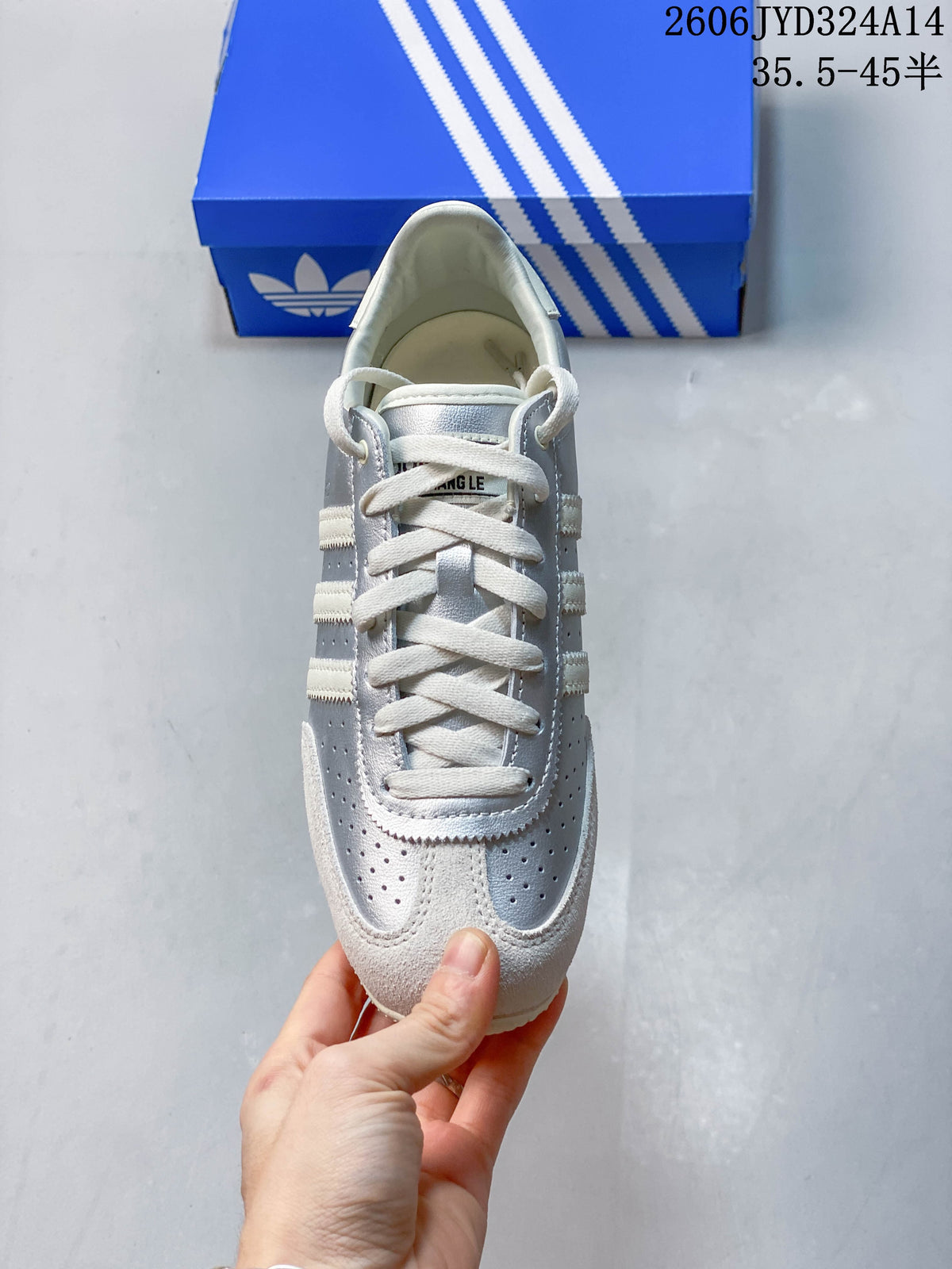 Top view of a silver and off-white Adidas CHANGLE lace-up sneaker