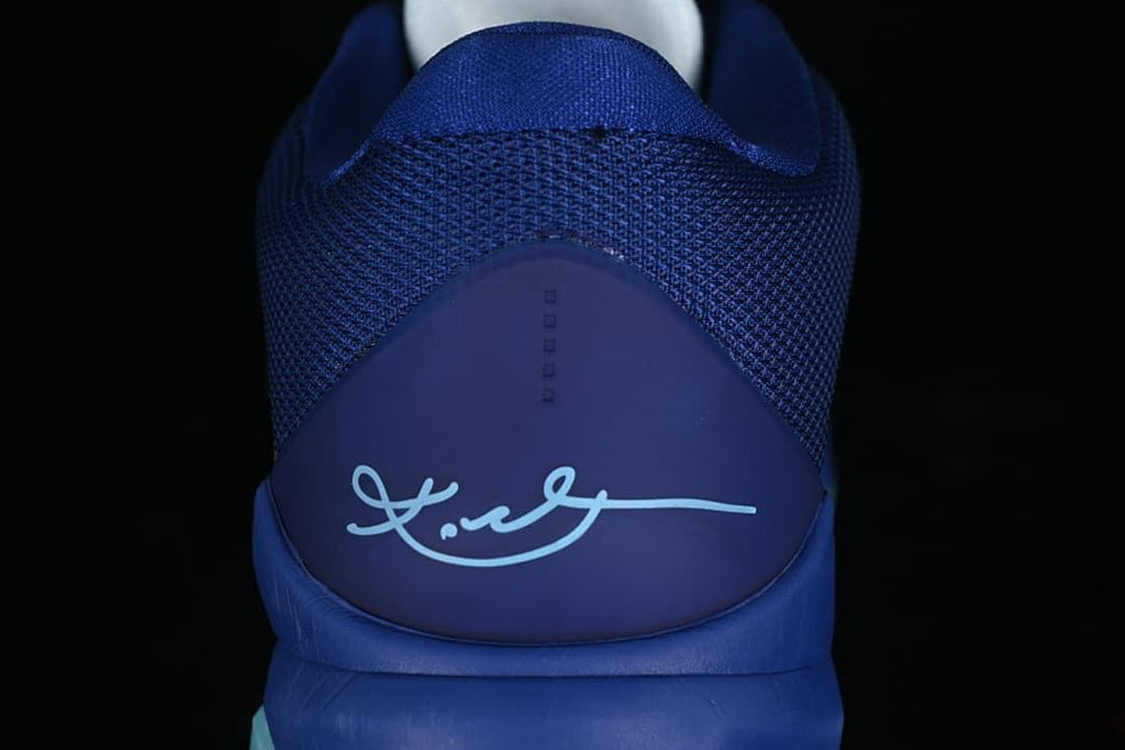 Rear view of the shoe showing mesh collar and Kobe signature
