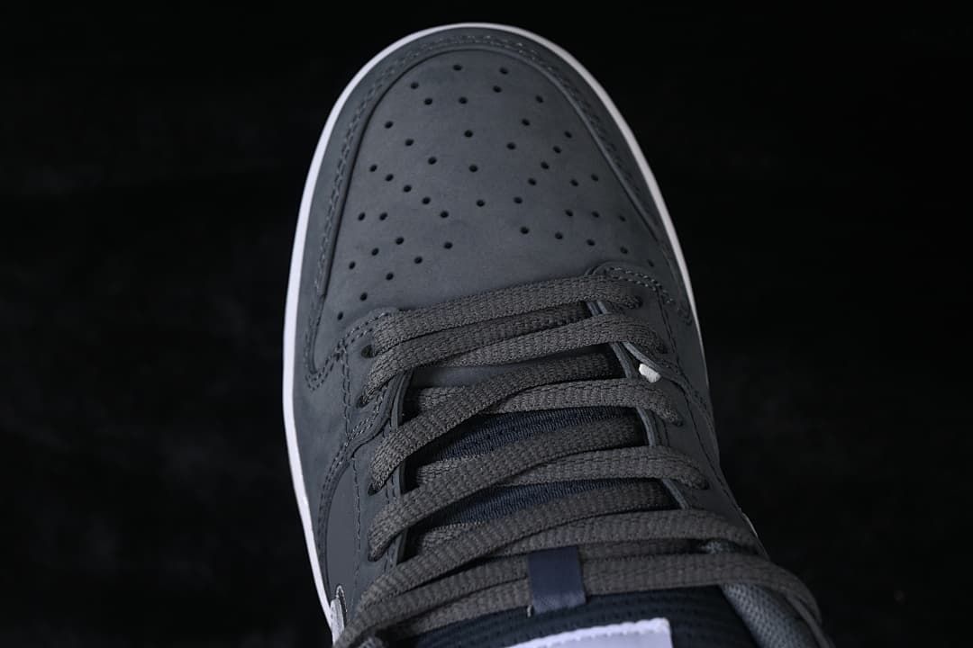 Top view of the perforated gray toe box and lace-up front.