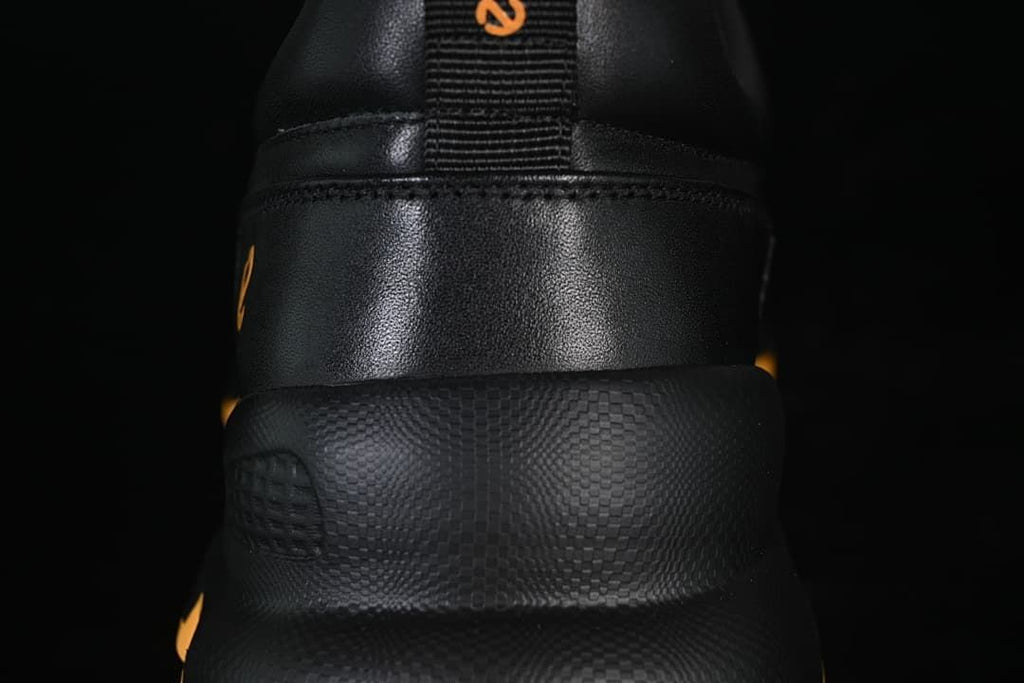 Rear close-up of the sneaker showing the heel panel and textured midsole