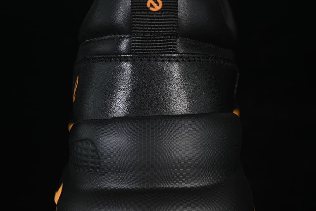 Rear close-up of the sneaker showing the heel panel and textured midsole
