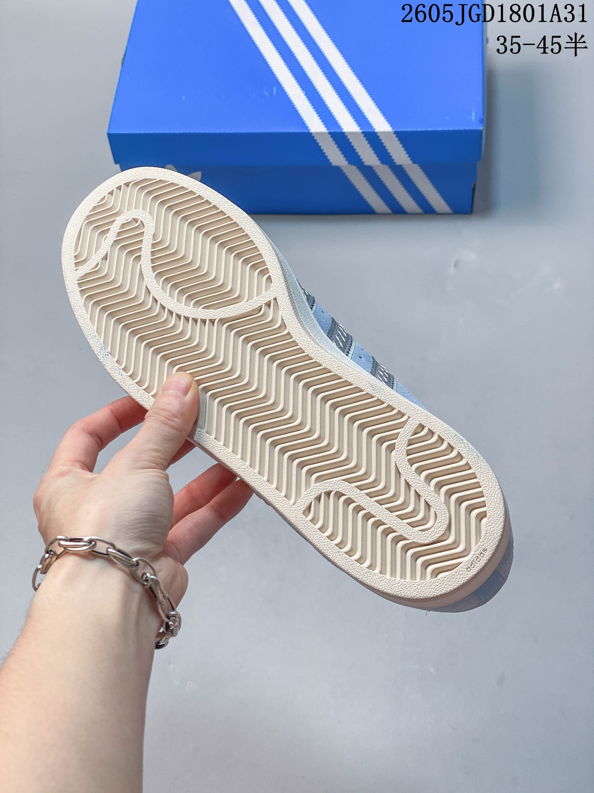 Close-up of the patterned cream outsole on a light blue Campus 00s sneaker.