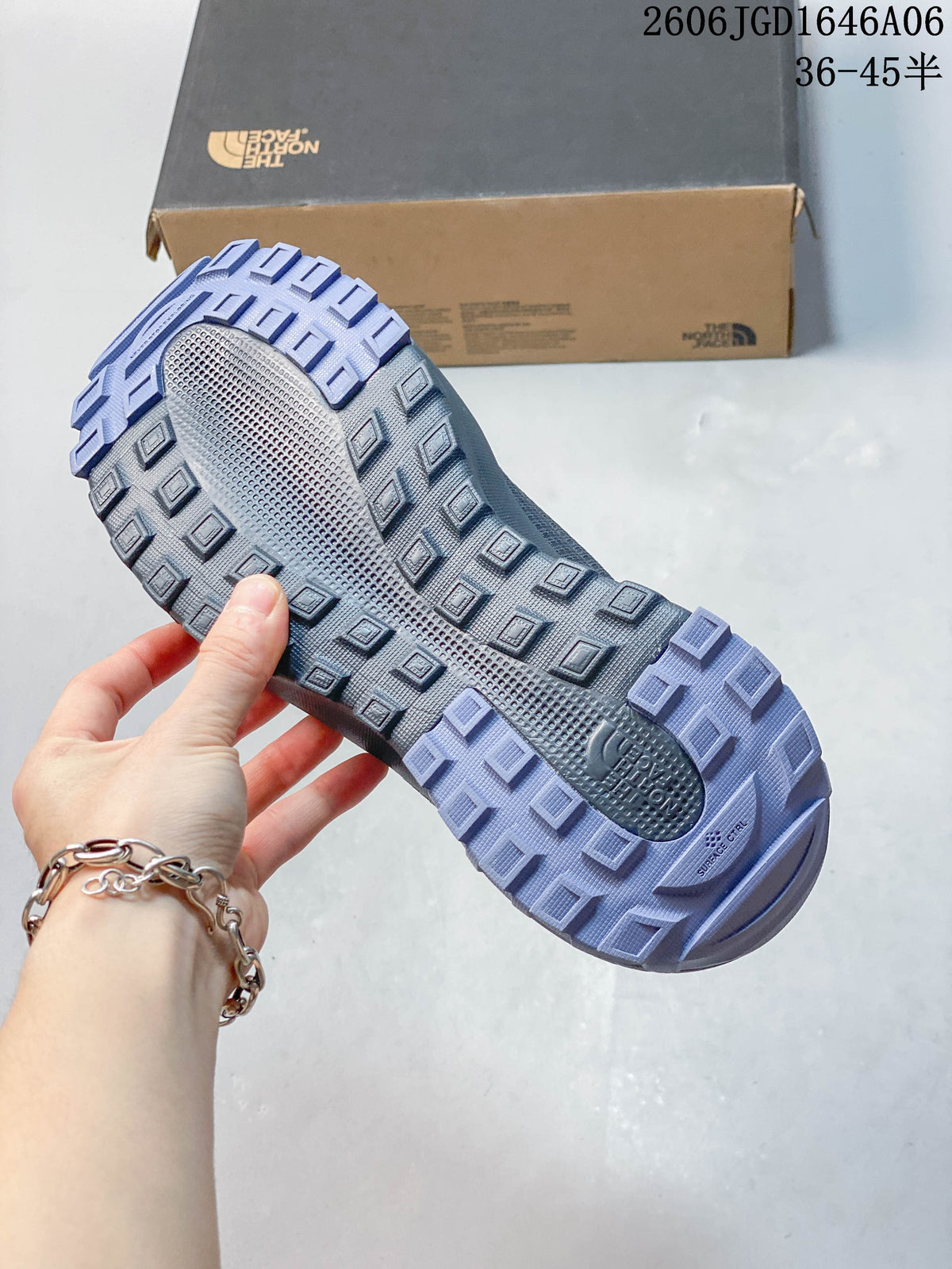 Close-up of the shoe outsole showing a lugged tread pattern