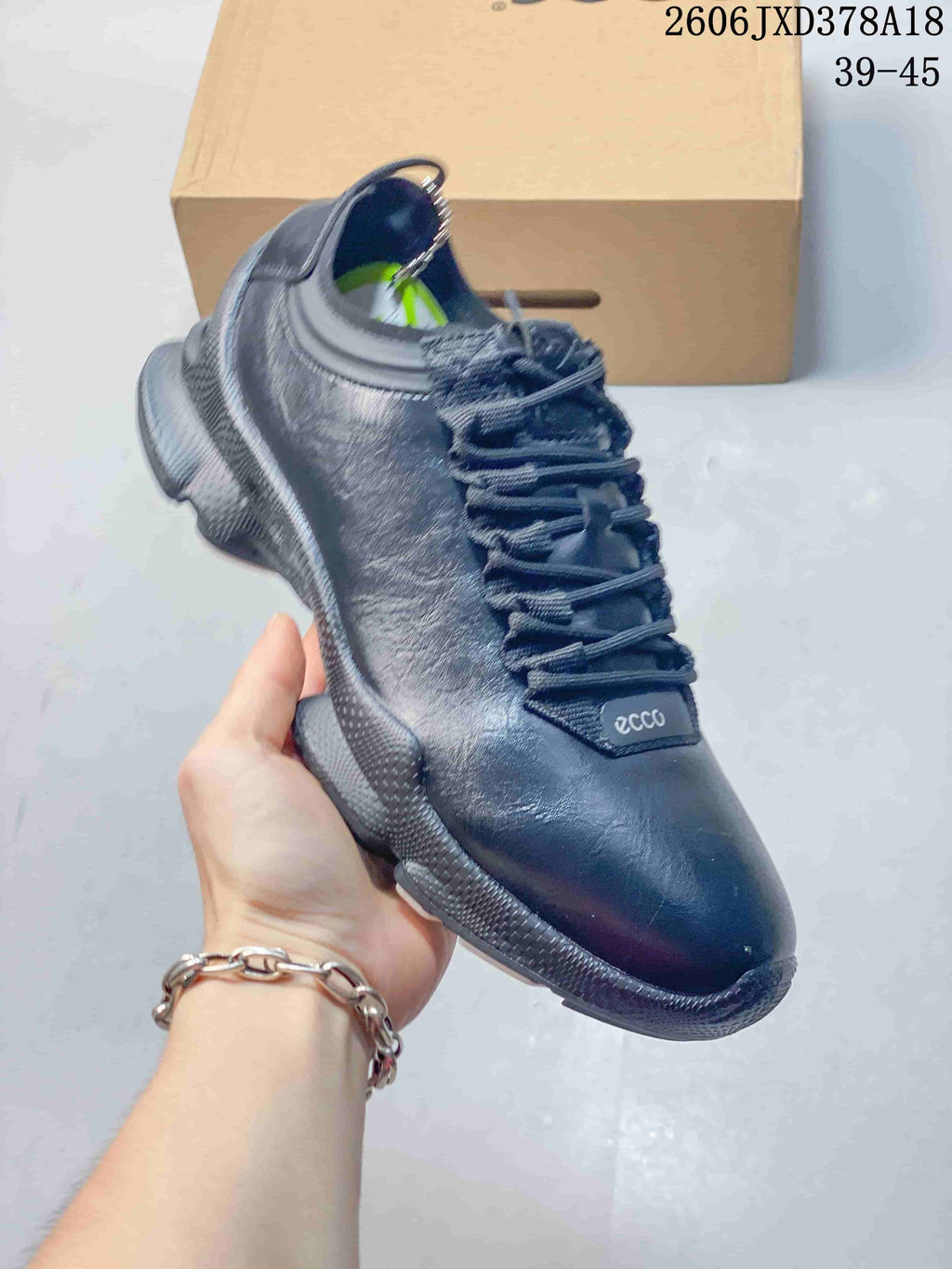 Angled view of a black ECCO lace-up sneaker