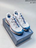 White and blue Salomon XT-6 shoes displayed on a blue shoebox