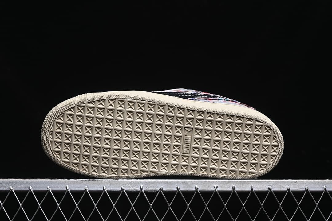 Underside of the sneaker showing a geometric tread pattern