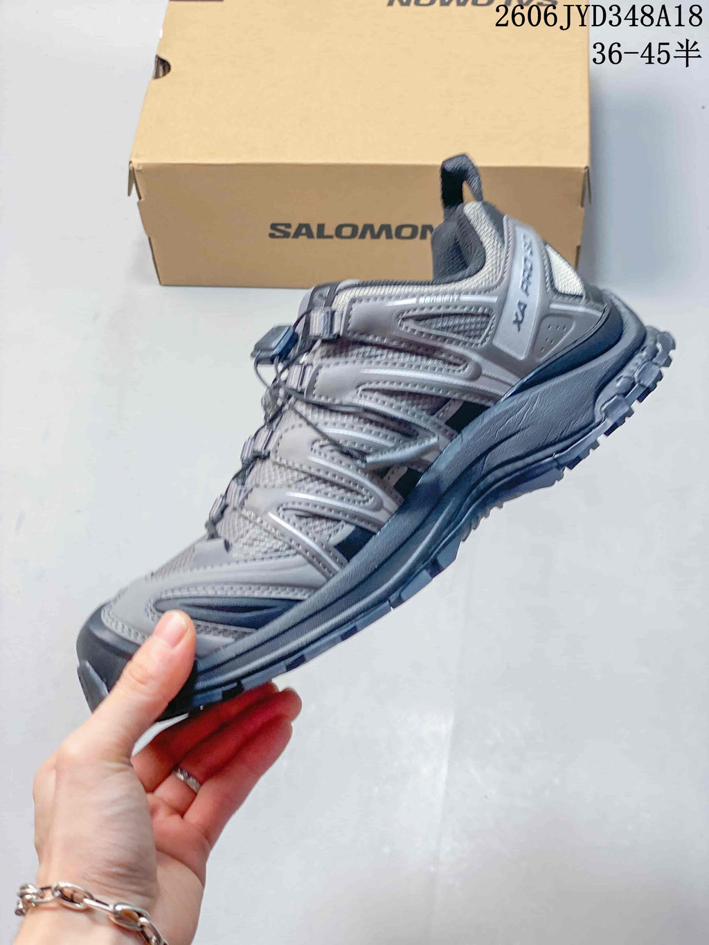 Side view of the gray trail running shoe