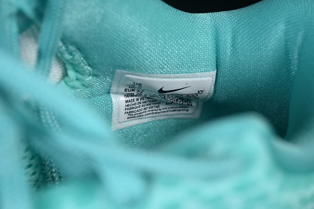 Interior size label inside the turquoise shoe.
