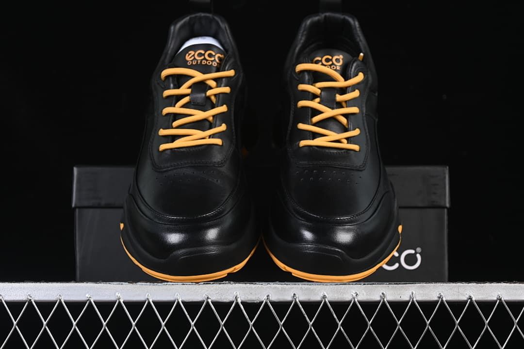 Front view of the pair showing their rounded toes and amber laces