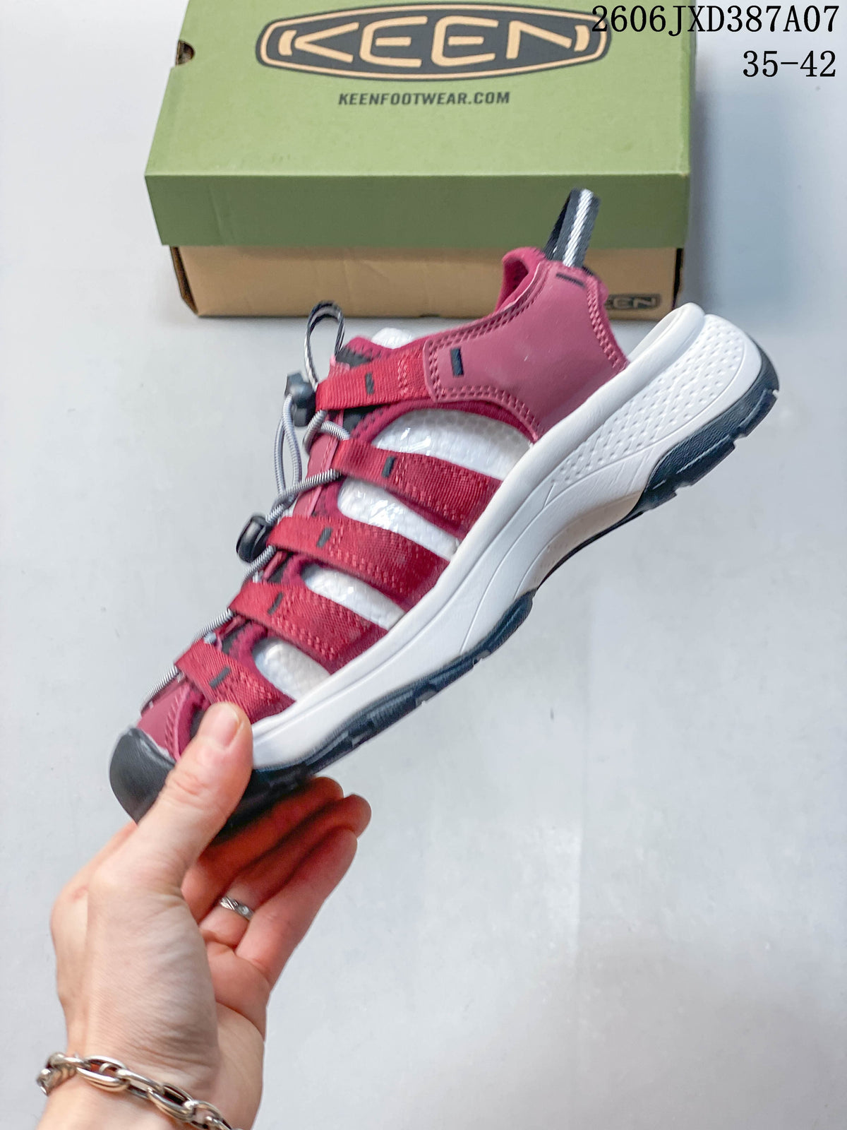 Side view of the berry sandal with open straps, toe bumper and bungee lacing.