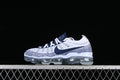 Side view of white and navy Nike Air VaporMax 2023 Flyknit sneakers with a transparent Air sole