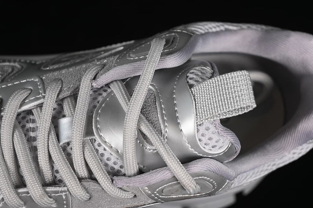 Close-up of the sneaker's laces, tongue, and upper panels.