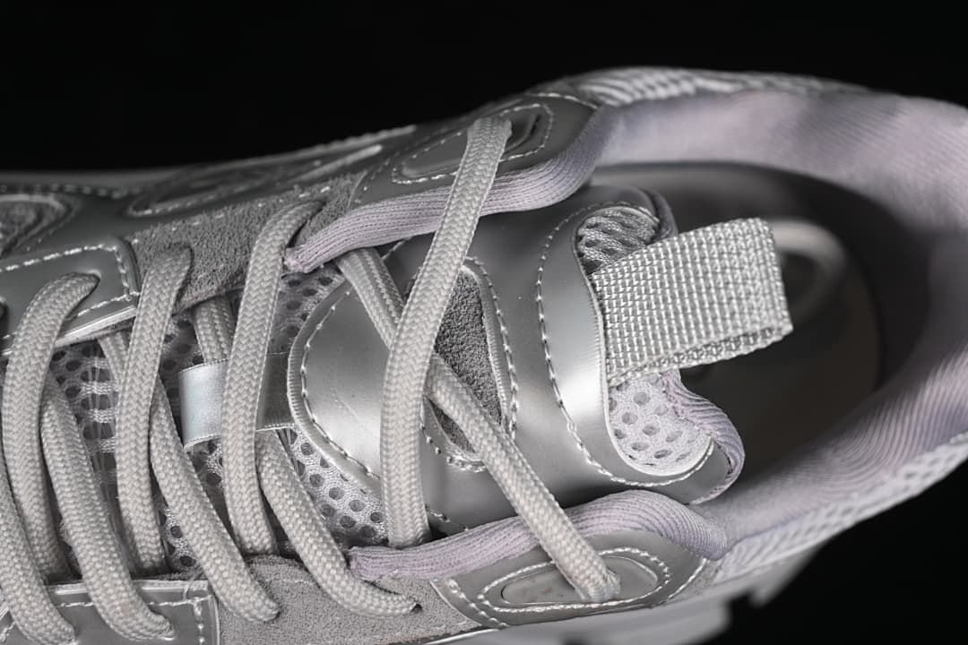 Close-up of the sneaker's laces, tongue, and upper panels.