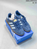 Pair of blue adidas low-top sneakers with light-colored stripes and gum-colored soles