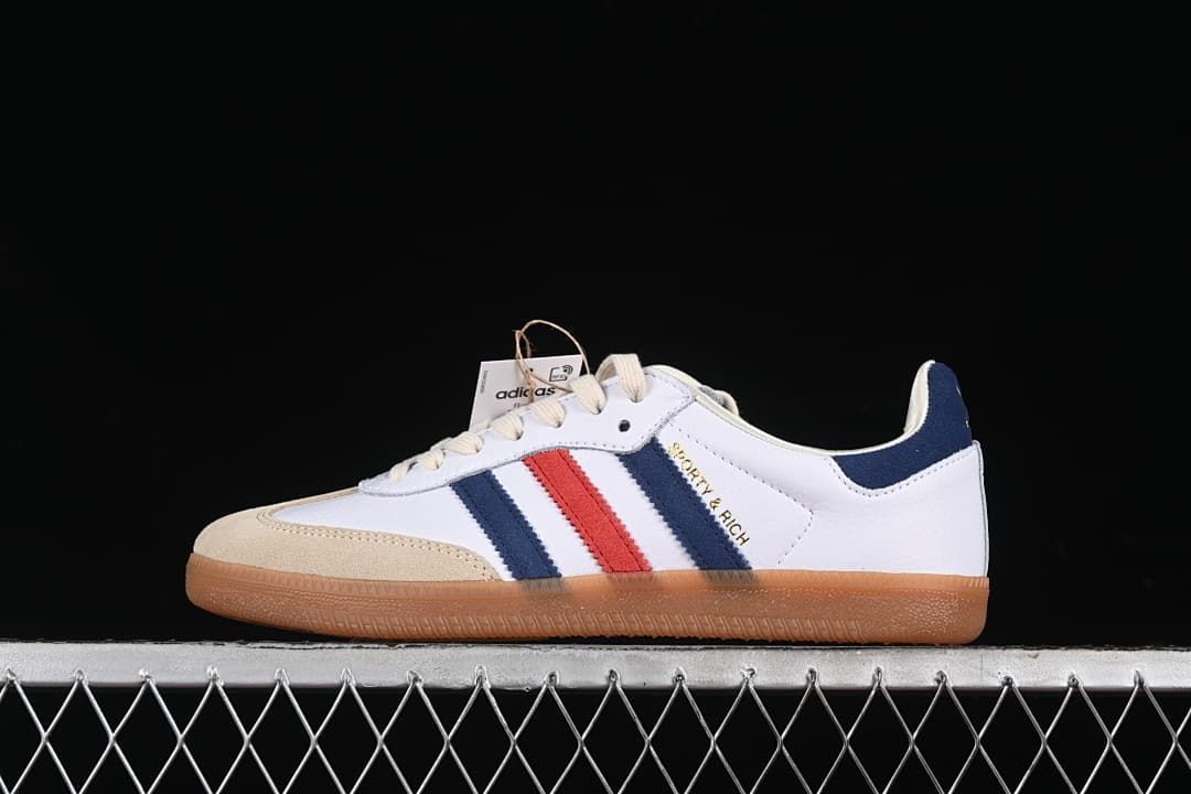 Side view of the adidas Samba OG Sporty & Rich in white, navy, red, and sand tones