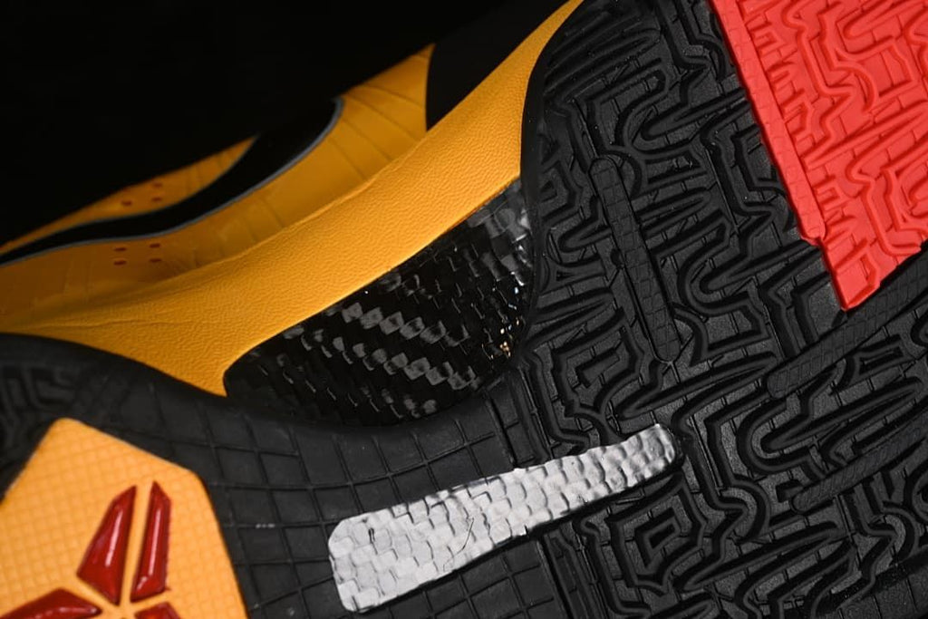 Close-up of the patterned black outsole with red section