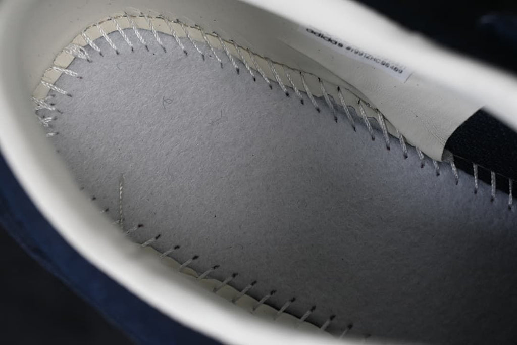 Close-up of interior stitching and lining.