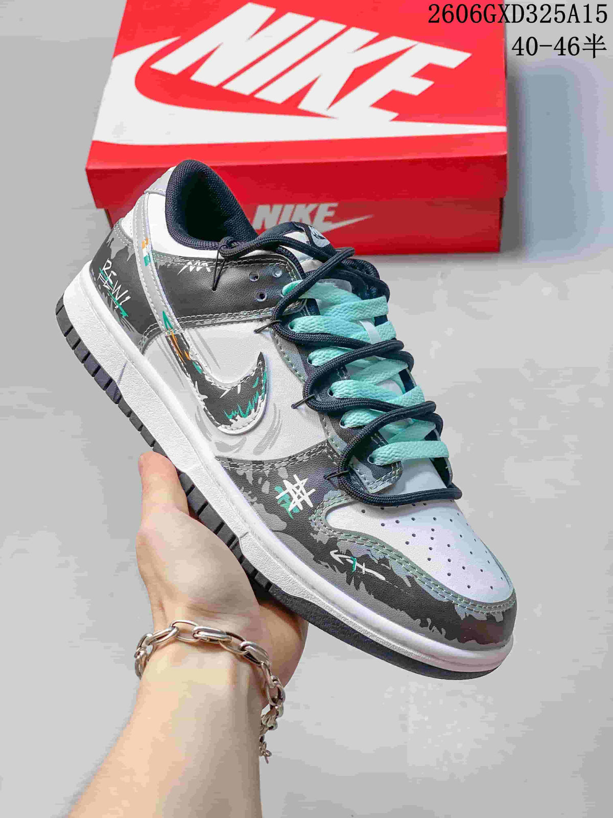 Side view highlighting the gray graphic overlays, white panels, and aqua laces