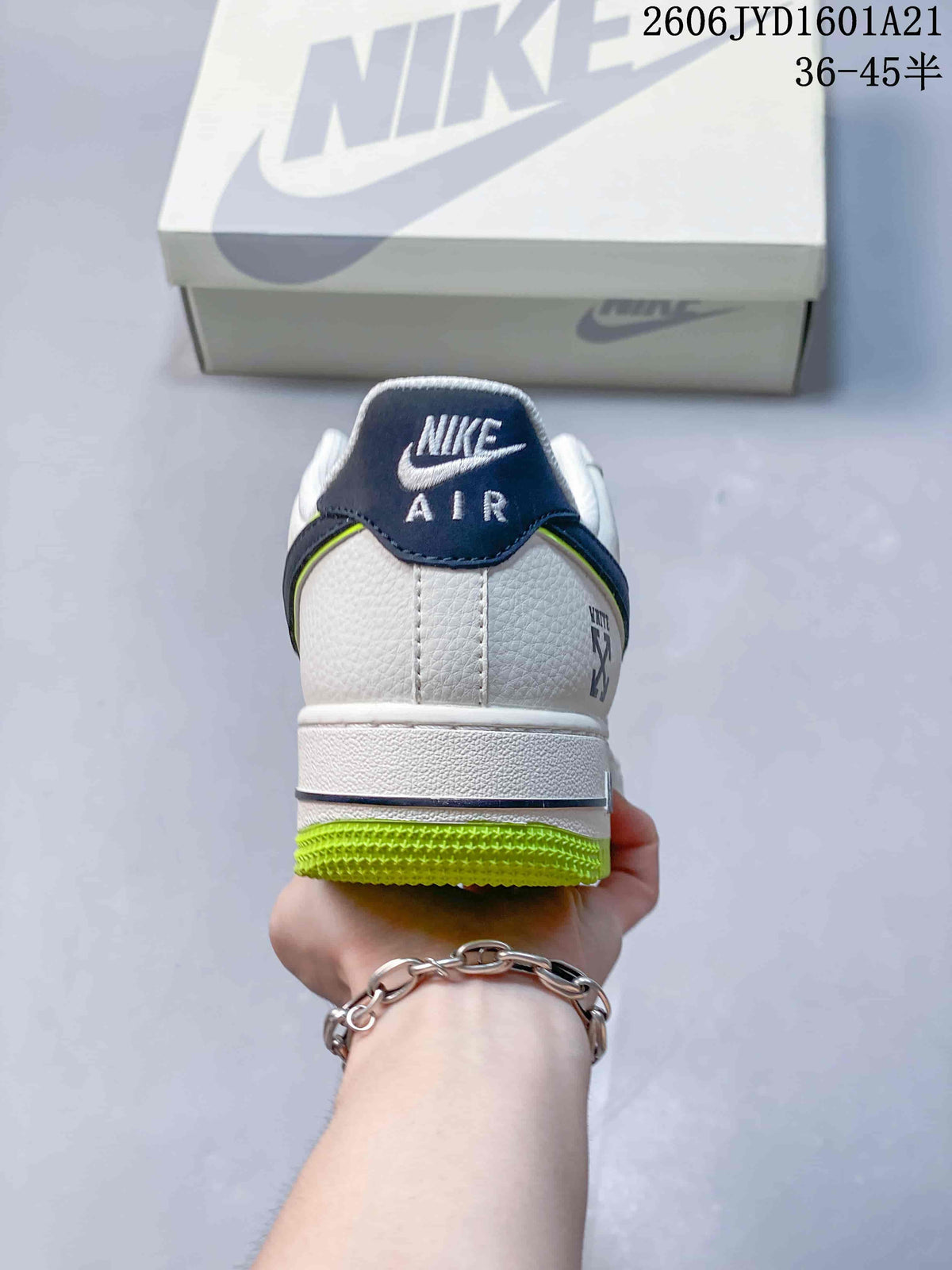 Rear view showing the sneaker's white heel, navy heel tab, and lime outsole
