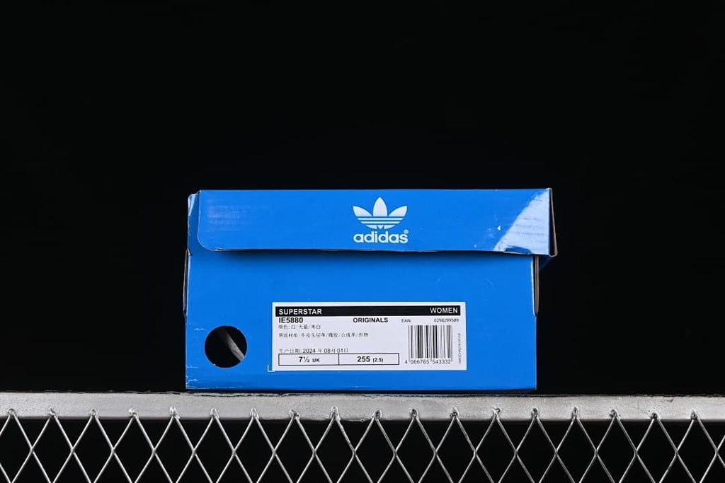 Blue adidas shoebox with label identifying Superstar IE5880 and Women