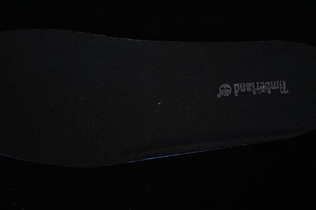 Dark insole shown separately against a dark background.
