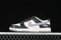 Side view of a black, white, and grey Nike SB Dunk Low with Stüssy details