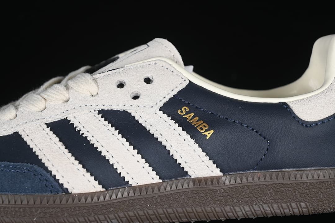 Close-up of the navy side panel, cream stripes, and Samba lettering