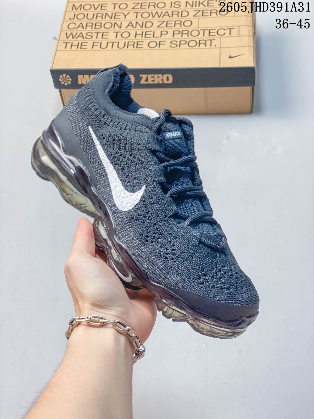 Navy Nike Air VaporMax 2023 Flyknit shoe shown at an angle with a visible air-cushioned sole.