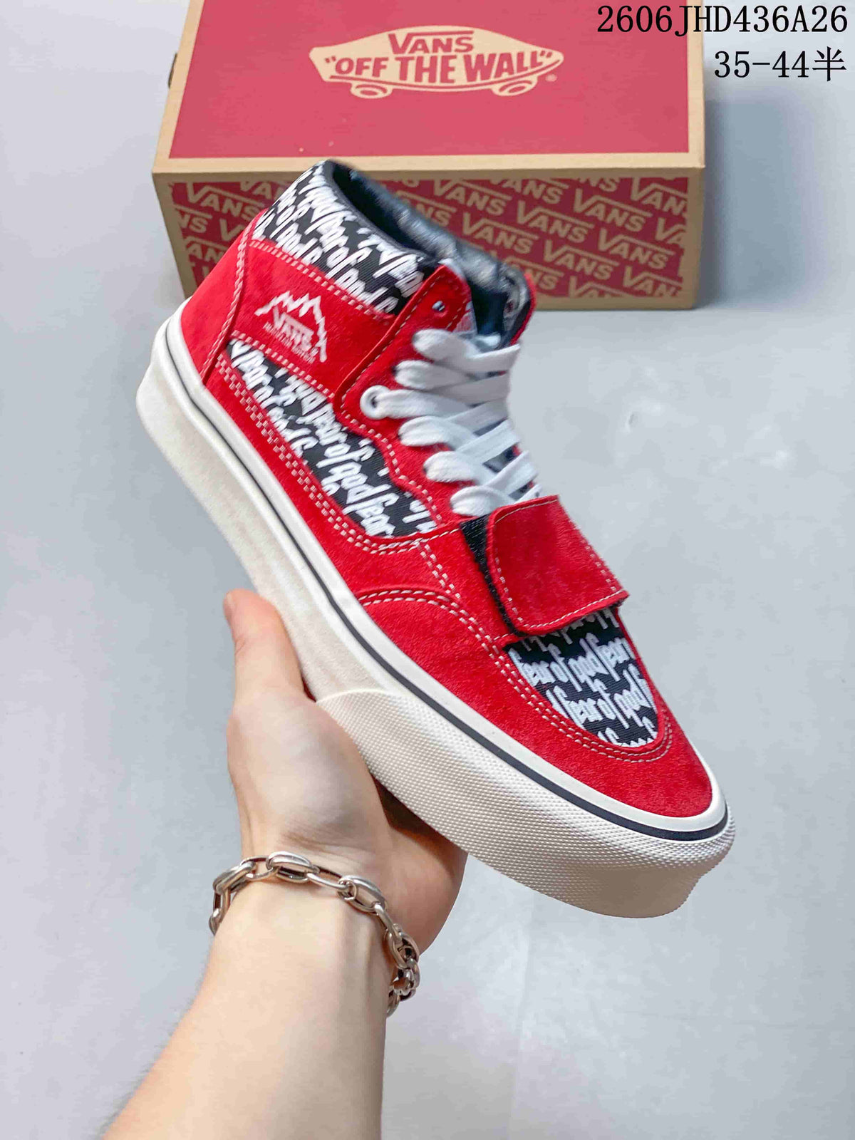 Side view of a bright red printed sneaker with white laces, forefoot strap and white sidewall.