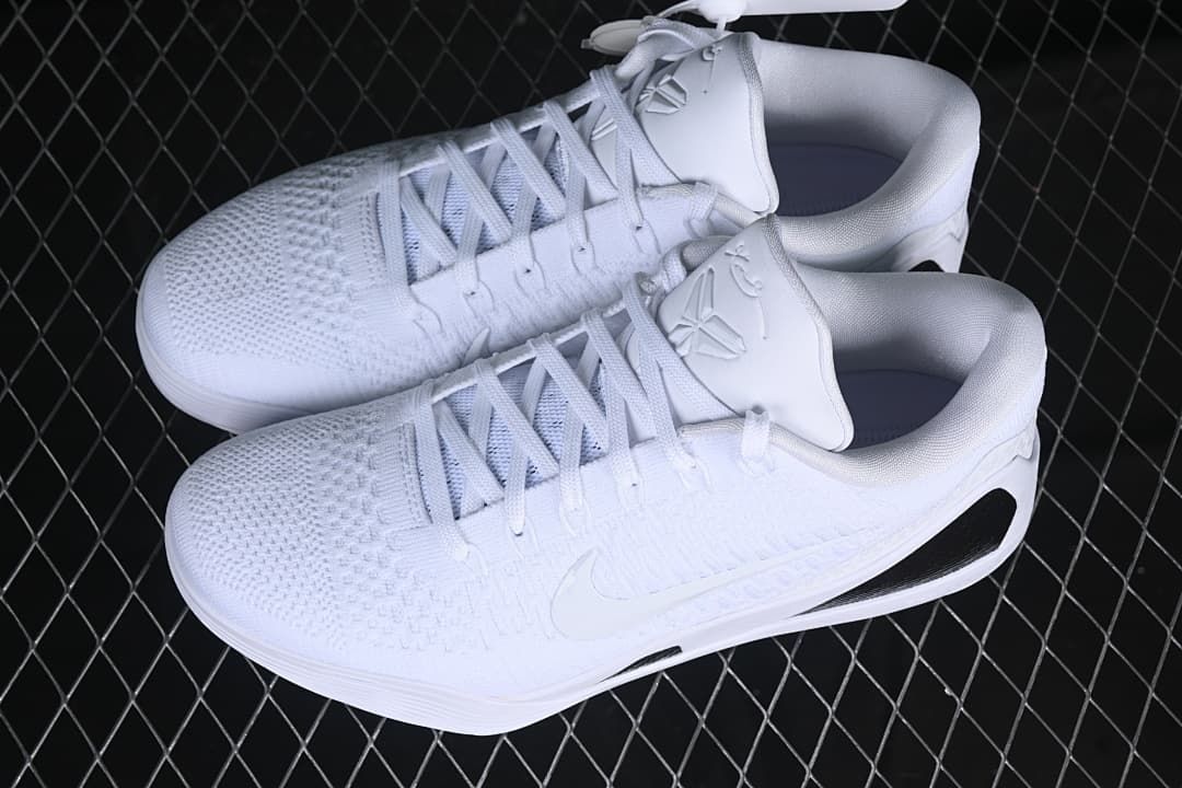 Pair of white low-top Kobe basketball shoes viewed from above