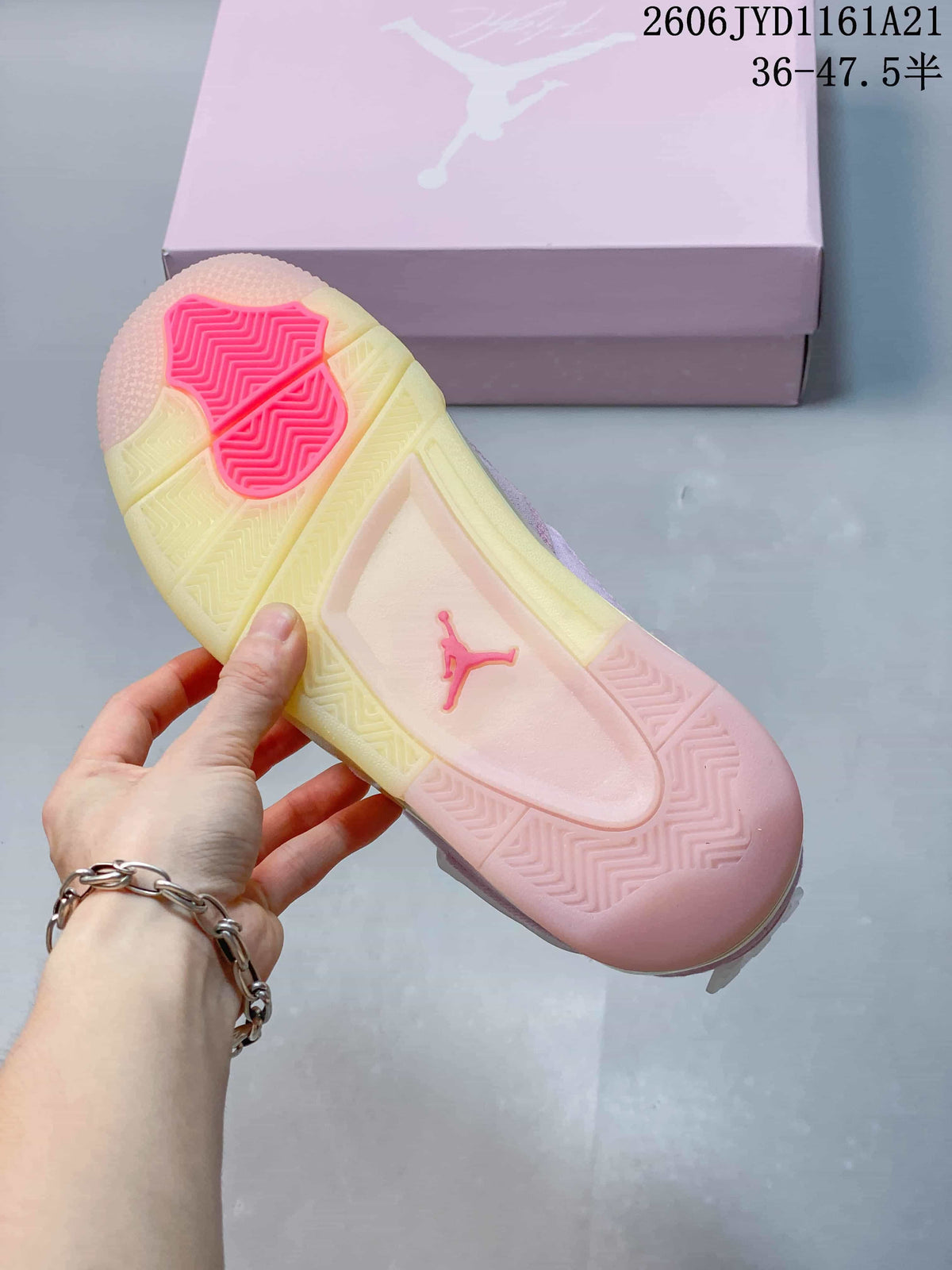 Underside of a pink Jordan sneaker showing a pale outsole with bright pink traction sections.