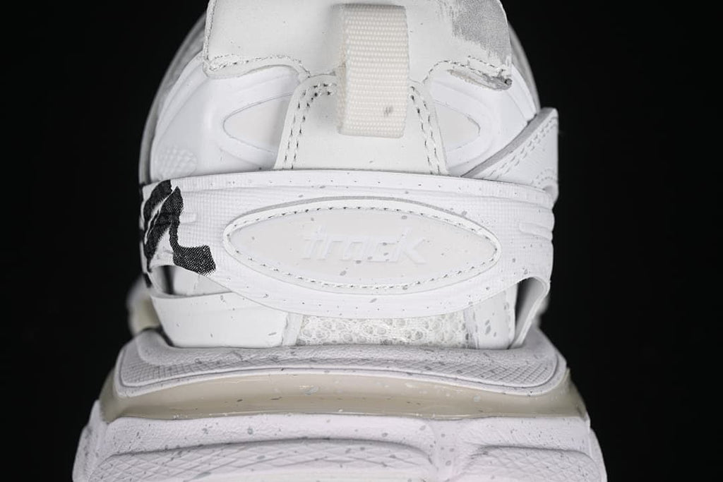 Rear close-up of the sneaker heel strap and sculpted midsole