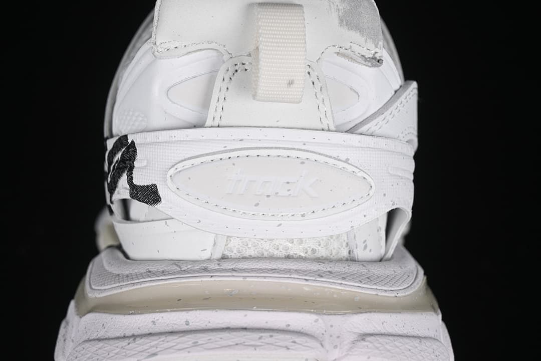 Rear close-up of the sneaker heel strap and sculpted midsole